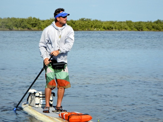 Tim looking for fish from his paddleboard.
