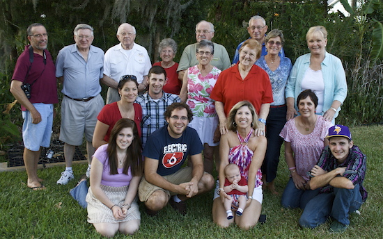 A family photo taken a couple years back. Mom is in the center of the back row.