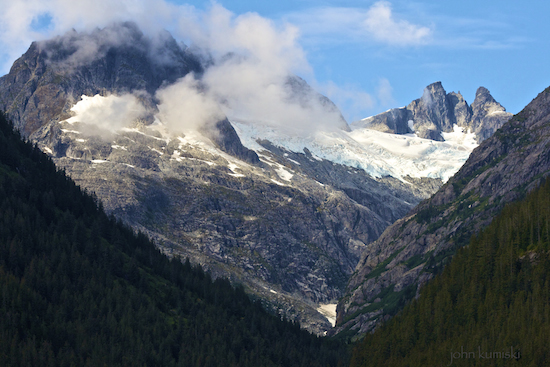 Snows from these high mountains feed the glacier.